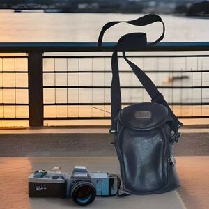 Case Logic Digital Camera Bag Leather Pockets Neck Strap Black Light Bulb Logo